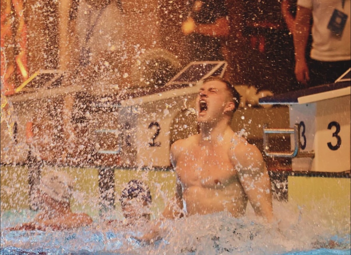 Swimmer celebrating after a race